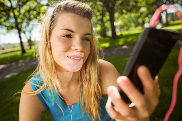 istock Fit blonde texting on her smartphone 824071966