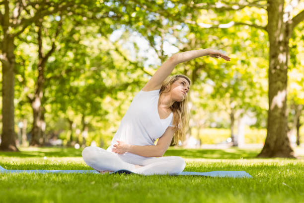 istock Fit blonde doing yoga in the park 824072150
