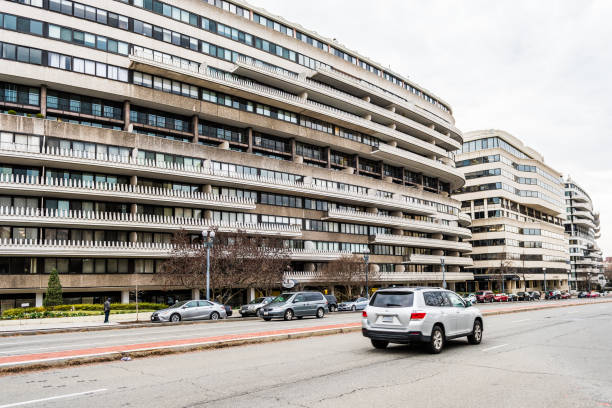 Watergate apartment building exterior with road and cars on Virginia avenue Washington DC: Watergate apartment building exterior with road and cars on Virginia avenue hotel watergate stock pictures, royalty-free photos & images