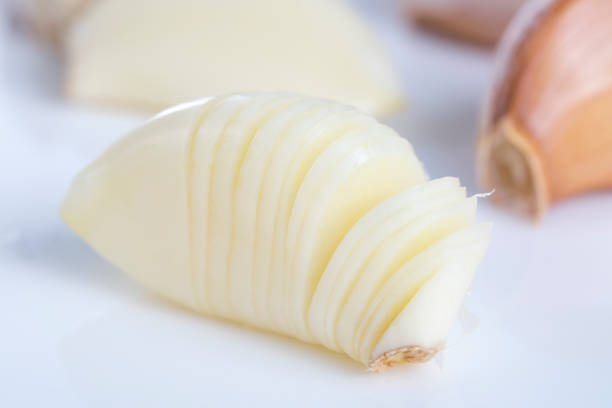 istock Closeup of garlic on the white background. 824078126