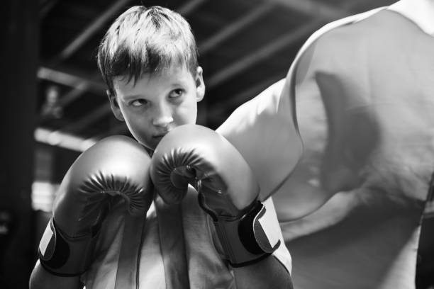 istock Superhero Champion Boxer Boy Strength Fighter Concept 824090374