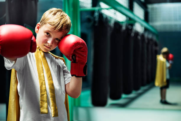 istock Superhero Champion Boxer Boy Strength Fighter Concept 824090434