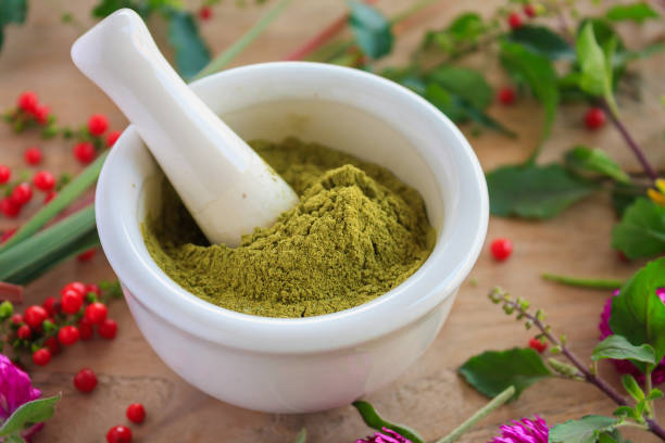 istock Fresh herbs powder in the mortar, alternative medicine 824091232
