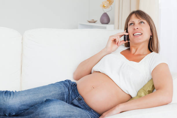 istock Relaxed pregnant woman phoning 824094096