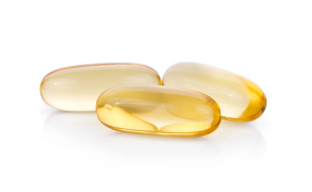 istock Fish oil pill on white background 824094630