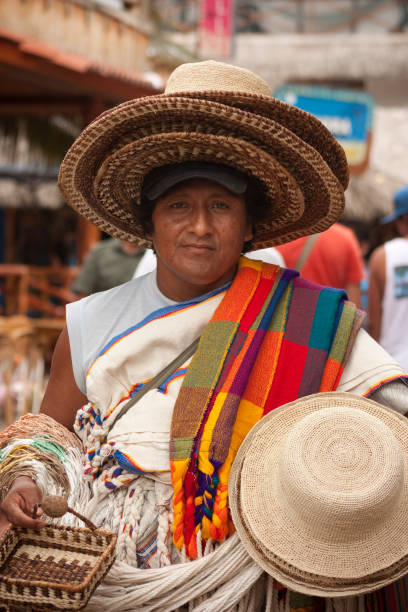 Montanita Portrait Montañita, Santa Elena, Ecuador - February 5, 2012: Portrait of a craft seller man walking at at the principal street on Montañita, Ecuador. Background some tiki stores. montanita ecuador stock pictures, royalty-free photos & images