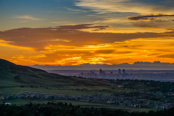 Sunrise - Denver, Colorado A stunning sunrise over Denver, as seen from Red Rocks Amphitheatre in Morrison, Colorado. morrison stock pictures, royalty-free photos & images