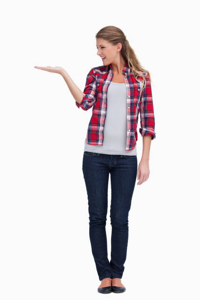 istock Portrait of a smiling woman displaying a copy space 824102426