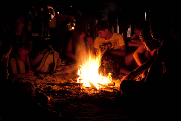 Montanita Mountaineer Ecuador Montañita Montanita, Santa Elena, Ecuador - February 5, 2012: A group of friends enjoying a bonfire at saturday night in Montañita, Ecuador. montanita ecuador stock pictures, royalty-free photos & images