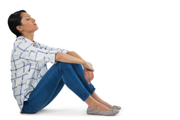 istock Woman relaxing against white background 824105550