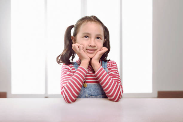 istock Funny asian little girl with happy expression 824105796