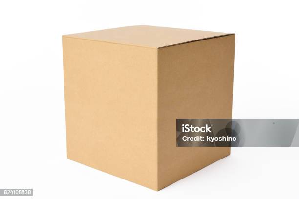 Isolated Shot Of Blank Cube Cardboard Box On White Background Stock Photo - Download Image Now