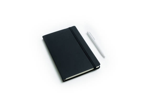 Notebook and white pen stock photo