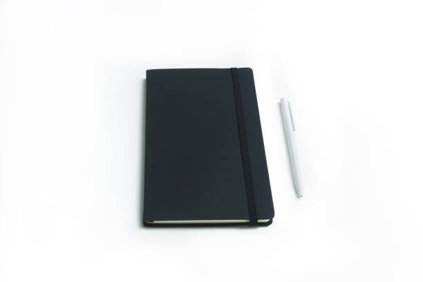 Notebook and white pen isolated stock photo