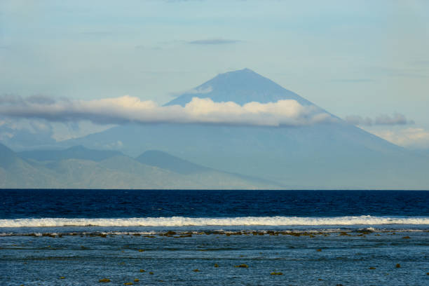 istock Blue sea with waves and mount on background 824109476
