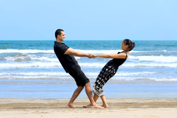 istock Happy interracial  couple enjoying  on beach 824111656