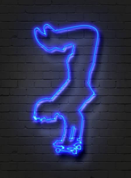 istock Skateboarder, neon sign on brick wall 824118958