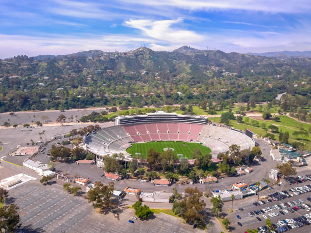 Rose bowl stadium in Pasadena CA Pasadena, California, USA-March 19, 2017. Historic Rose Bowl stadium in Pasadena near Los Angeles, California. Empty stadium during the week getting it ready for upcoming games and promoting the 2028 Olympics. At the time of the image they were preparing for a Rose Bowl Football Game. The 2017 Rose Bowl Football Game features the USC and Penn State college football teams playing during the 2017 season. The Rose Bowl Football Game is usually played on New Years Day, however, this years game will be played on Monday due to New Years Day landing on a Sunday. the rose bowl stock pictures, royalty-free photos & images