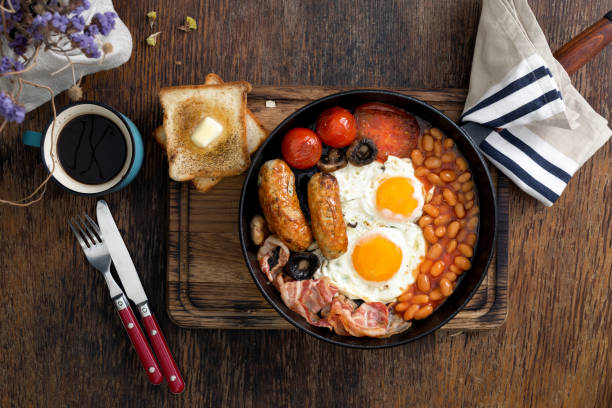 English breakfast with cup of coffee English breakfast with cup of coffee on wooden table english breakfast stock pictures, royalty-free photos & images