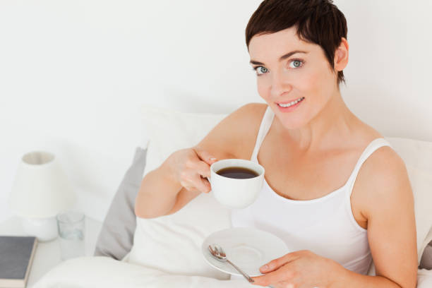 istock Close up of a woman drinking coffee 824122164