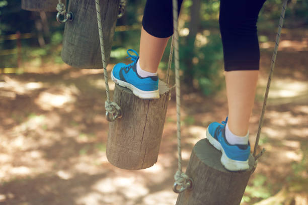 istock mentain your balance on suspended bridge 824122570
