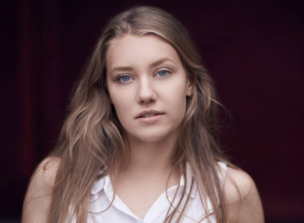 istock beautiful woman looking at camera 824125458
