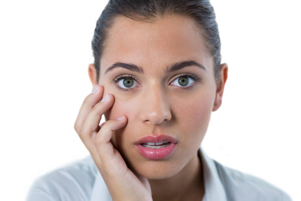 istock Surprised female executive standing against white background 824126098