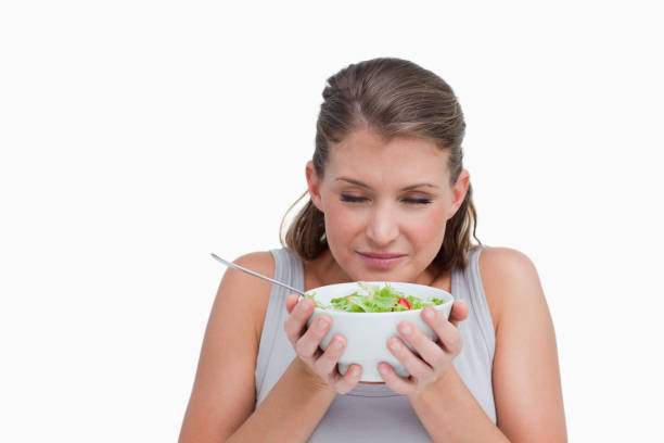 istock Woman smelling a salad 824126728