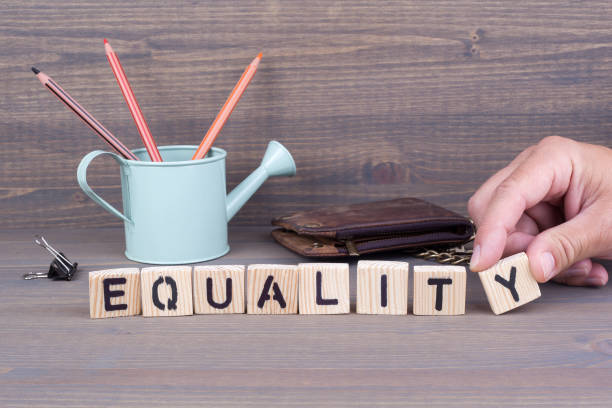 istock Equality concept.Wooden letters on dark background 824132522