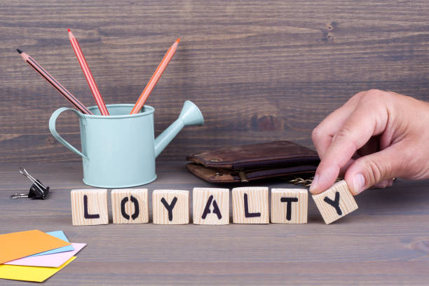 istock Loyalty. Wooden letters on dark background 824132630