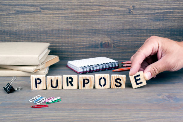 istock purpose. Wooden letters on dark background 824132944