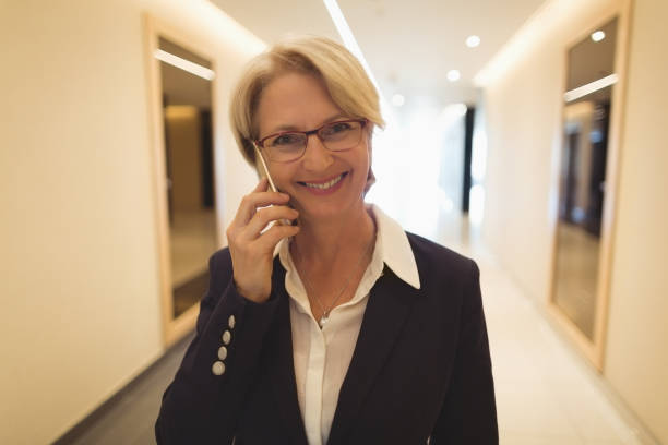 istock Smiling businesswoman talking on phone 824132980