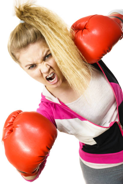 istock Angry woman wearing boxing gloves 824135826