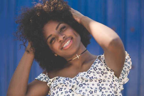 istock Young beautiful afro american woman holding hands on head 824136714