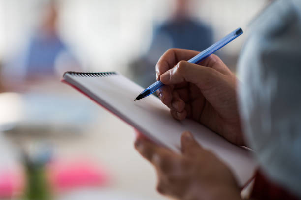 istock Close up of unrecognizable person taking notes. 824139754