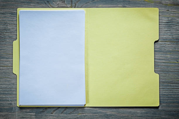 istock Cardboard office paper folder on wooden board 824142946