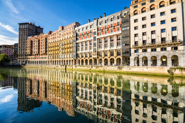 bilbao riverbank on sunny day, spain
