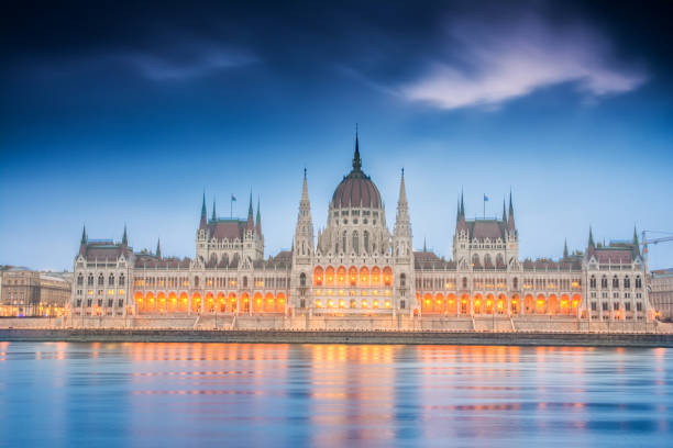 istock riverside views to budapest parliament at sundown, hungary 824151792