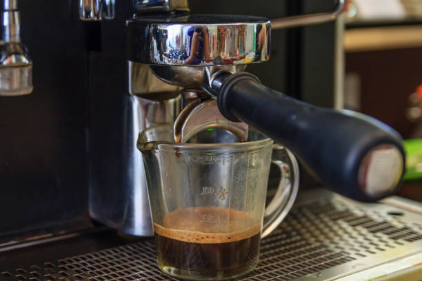 istock coffee machine preparing fresh coffee and pouring into cups at restaurant, Professional coffee brewing 824157916