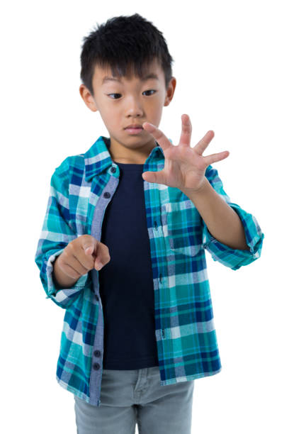istock Boy pretending to touch an invisible screen 824160390