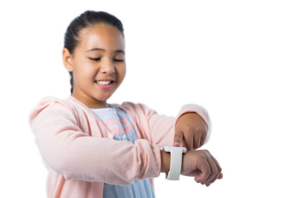 istock Smiling girl operating her smart watch 824160812