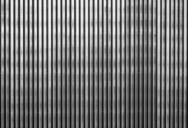 istock Old rusty corrugated metal wall of a barn building 824164062