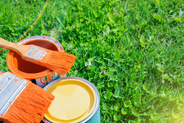 istock Paint cans, brushes, bright orange color 824173608