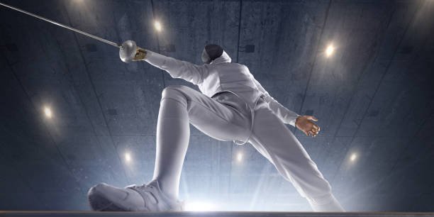 istock Female fencer on big professional stage. Bottom view 824174386