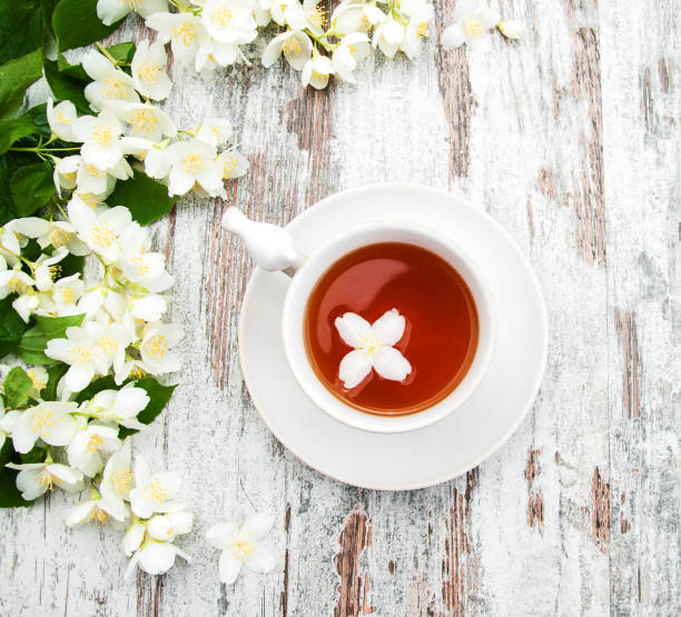 istock Cup of tea with jasmine flowers 824175434