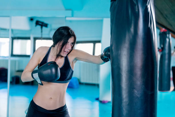 istock Female boxer in gym 824175640