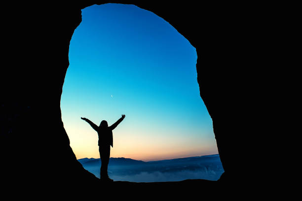 istock Female traveler in mountains at night 824179032