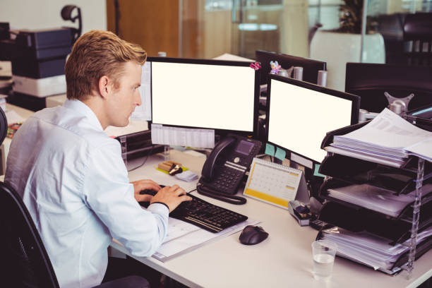 istock High angle view of businessman working on computer at desk 824179326