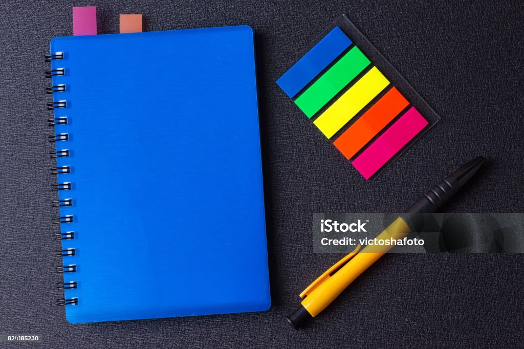 Blue Notepad With Multicolored Stickers And Pen Stock Photo - Download ...