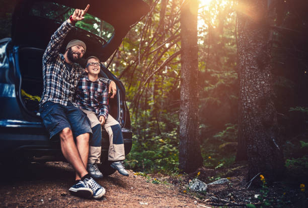 istock Father and son travelling by car 824186054
